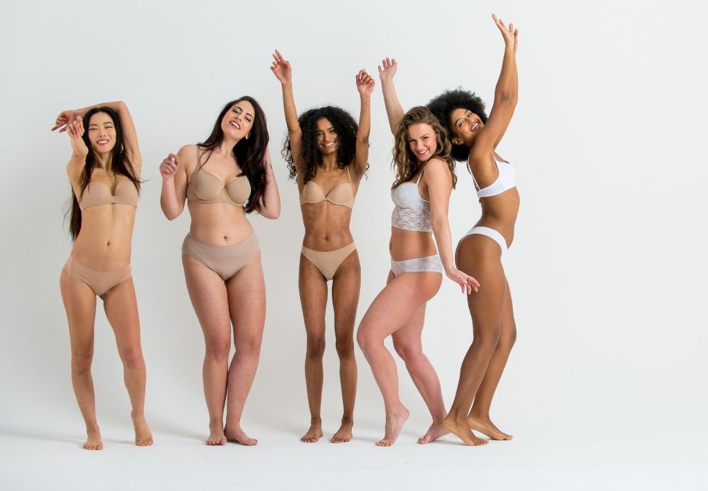 we see a diverse group of 5 women who are happy because they have all successfully learned how to lose 50 pounds in 6 months.