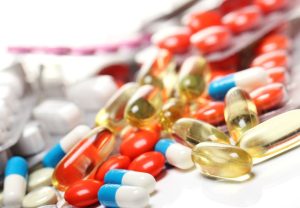 a collection of colored pills, tablets, capsules and creams are used correctly to eliminate progesterone side effect.