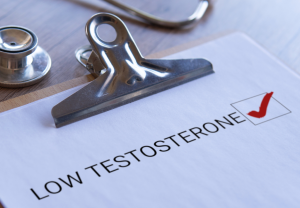 a clipboard with low testosterone written on it with a check next to those words. this illustrates the checklist guys can use to determine how is testosterone produced in men, and if they need further evaluation.