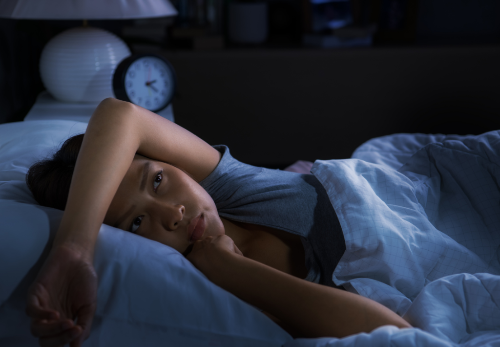 a woman is up and sweating at 2:30am. She is experiencing hot flashes and is uncomfortable with her arm over her head. She could benefit from Hormone Replacement Therapy For Women.