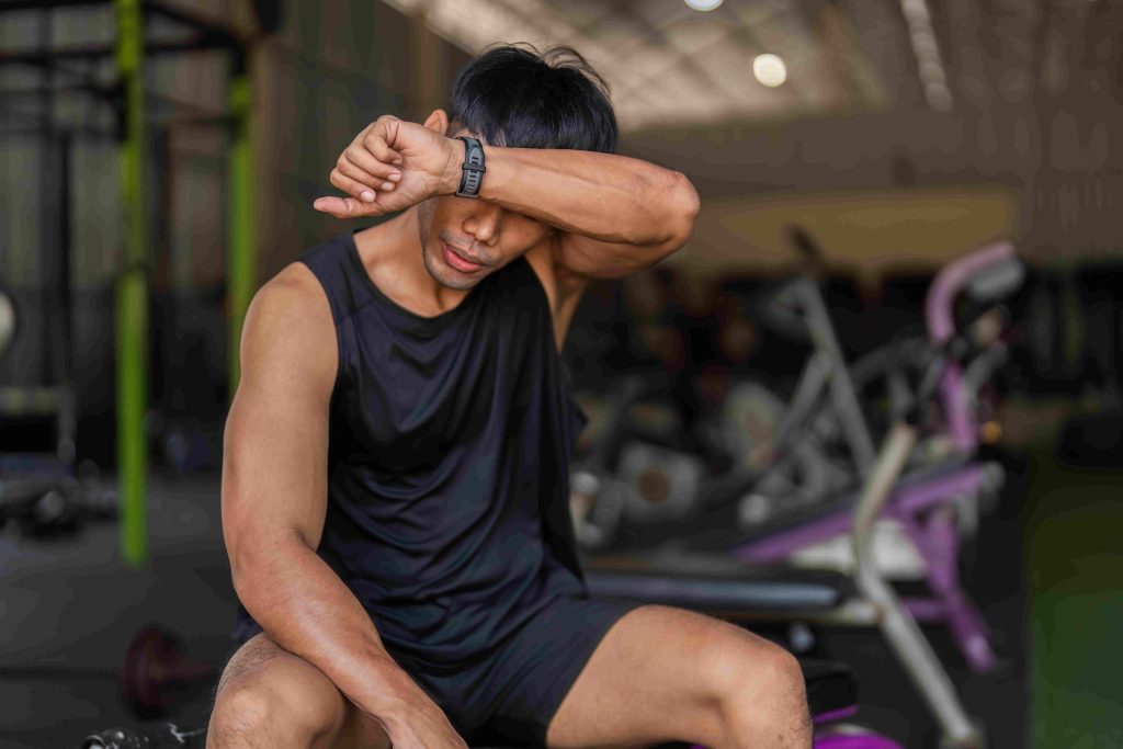 a guy is exhausted in the gym. he's getting older and might need testosterone replacement therapy.